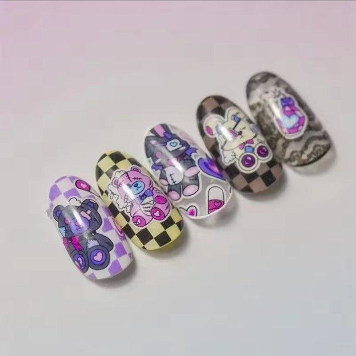 Dark bunny bear capsule nail art shown on finished manicure