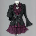 Midnight Violet Pleat Set with black ruffle cardigan and violet dress