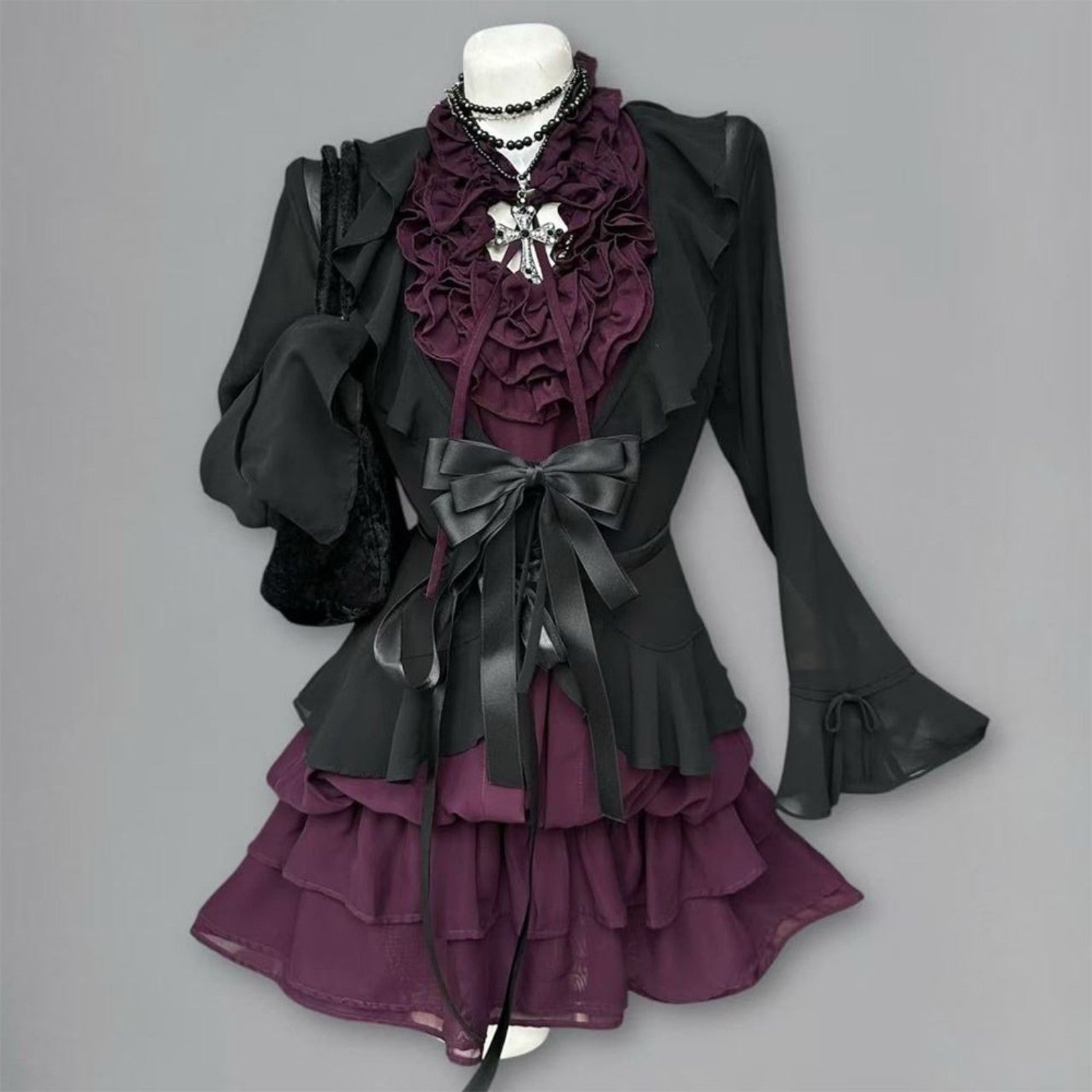 Midnight Violet Pleat Set with black ruffle cardigan and violet dress