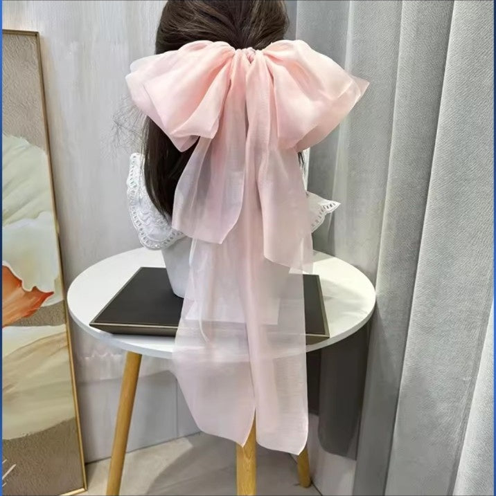 Pink oversized fairy ribbon bow hair clip back view
