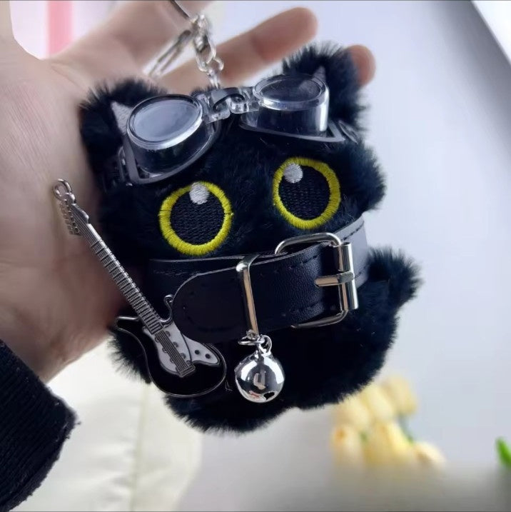Cute black cat bag charm with punk goggles and guitar detail