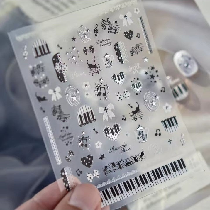 Romantic music nail sticker sheet with piano, bows, cats, hearts and musical notes