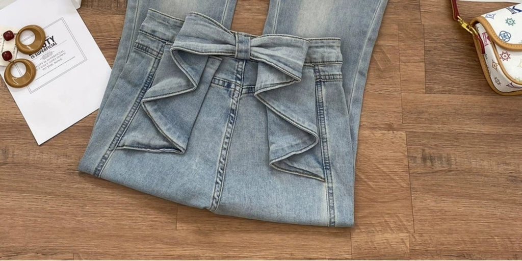 Bow detail on light wash flared jeans