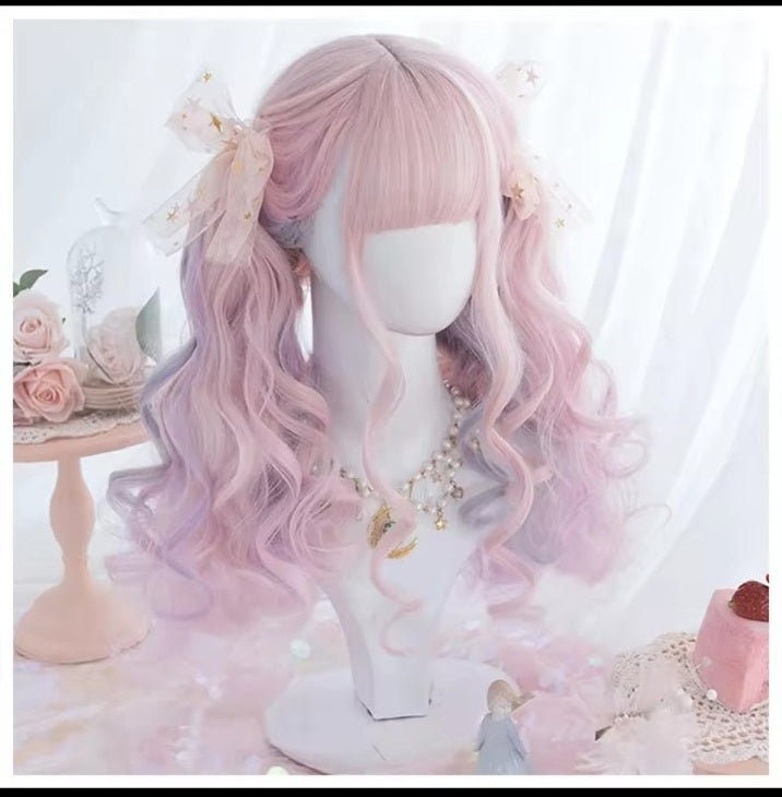 Peach pink long wavy synthetic wig styled in twin tails