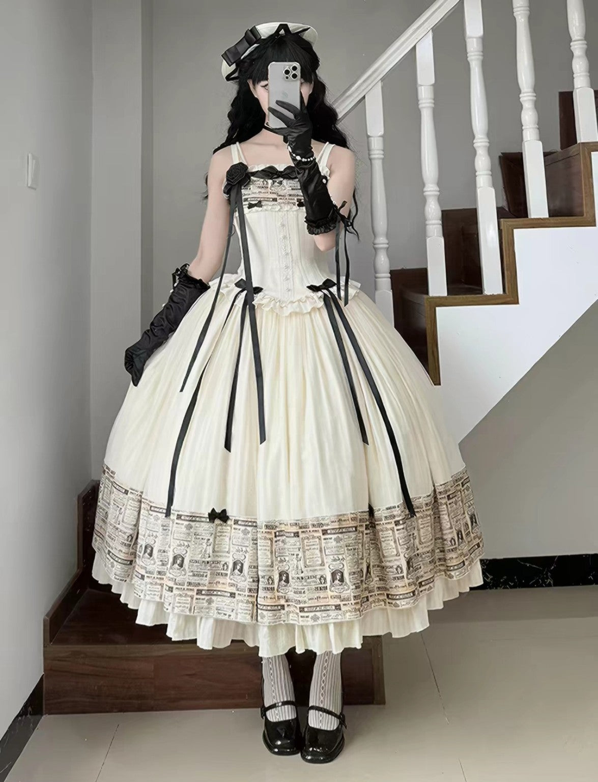 Cream Lolita dress with black ribbon and newspaper print trim