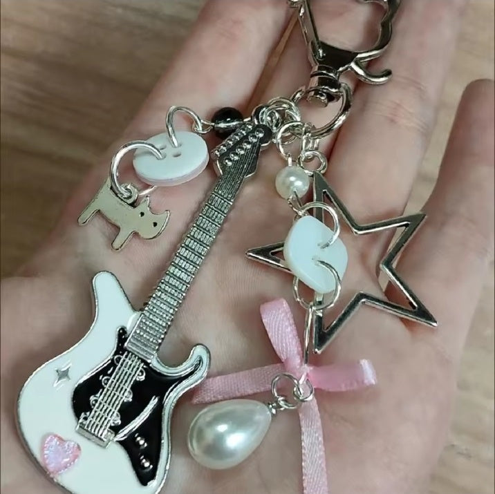 Pink Y2K guitar keychain close-up