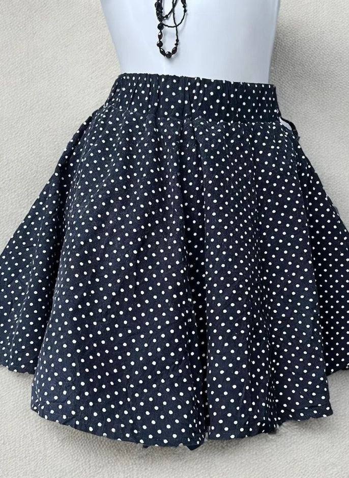 Navy and white polka dot skirt detail